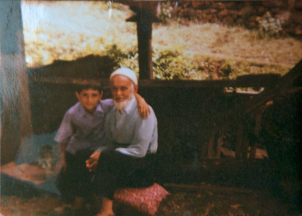 Selim Koç as a boy with his grandfather